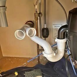 Leaking under-sink drain pipes in a Rockwall home before repair
