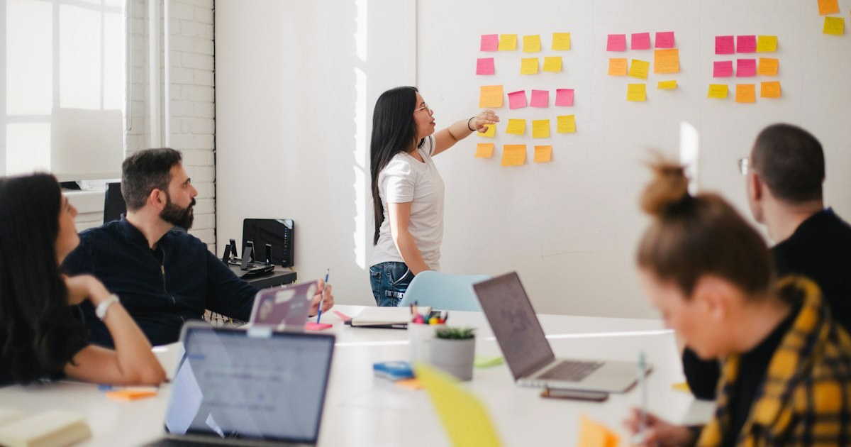Women in a business workshop planning with sticky notes on the wall